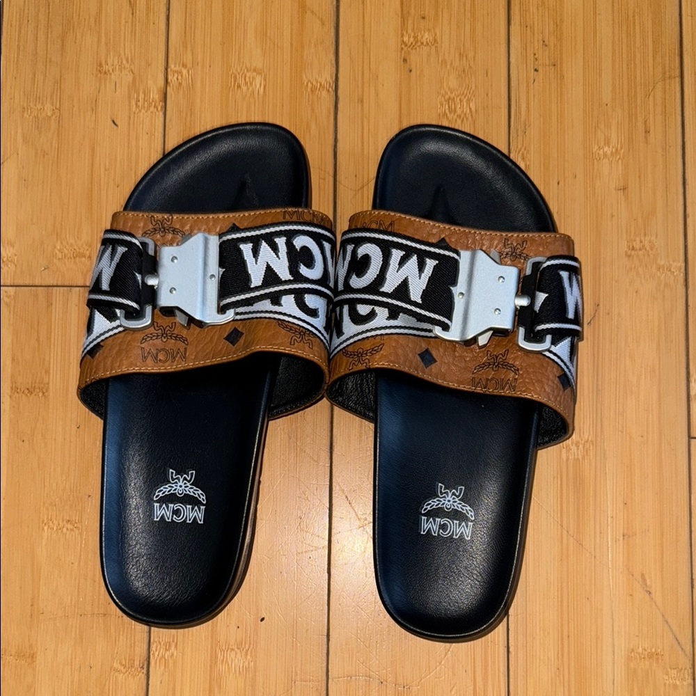 MCM Tan and Black Logo Slides